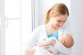 Newborn baby in tender embrace of mother Royalty Free Stock Photo