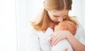 Newborn baby in tender embrace of mother Royalty Free Stock Photo