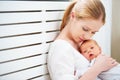 Newborn baby in tender embrace of mother Royalty Free Stock Photo