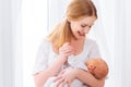 Newborn baby in tender embrace of mother Royalty Free Stock Photo