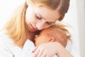 Newborn baby in tender embrace of mother Royalty Free Stock Photo