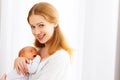 Newborn baby in tender embrace of mother Royalty Free Stock Photo