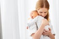 Newborn baby in tender embrace of mother Royalty Free Stock Photo