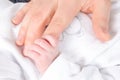 Newborn baby touching his mother hand closeup detail Royalty Free Stock Photo