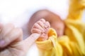 Newborn baby touching his mother hand, Baby holding finger of his mother giving senses of attachment and bonding. The image taken Royalty Free Stock Photo