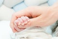 Newborn baby touching his mother hand Royalty Free Stock Photo