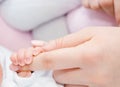 Newborn baby touching his mother hand Royalty Free Stock Photo