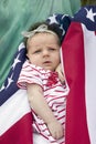 Newborn baby warpped in American flag Royalty Free Stock Photo