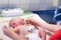 Newborn baby washed after birth Royalty Free Stock Photo