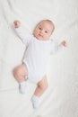 Newborn baby in white romper Royalty Free Stock Photo