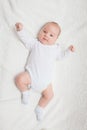 Newborn baby in white romper