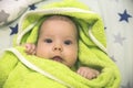 Newborn baby wrapped in a green towel after bathing Royalty Free Stock Photo