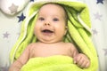 Newborn baby wrapped in a green towel after bathing Royalty Free Stock Photo