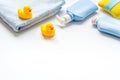 Newborn bath time concept with care cosmetics product