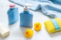 Newborn bath time concept with care cosmetics product