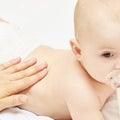 Newborn boy, mother hand. Infant mom massage. funny children change diaper. Home Royalty Free Stock Photo