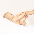 Newborn boy, mother hand. Infant mom massage. funny children change diaper Royalty Free Stock Photo