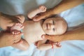 Newborn care. Baby massage. Newborn baby given body massage. Healthy massage therapy. Massaging the babys arms and legs