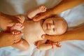 Newborn care. Baby massage. Newborn baby given body massage. Healthy massage therapy. Massaging the babys arms and legs