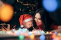 Mother and Baby Celebrating Christmas under the Tree