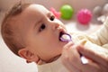 Newborn child drinking water or medicine cough syrup with spoon, close up. little baby drink medical syrup Royalty Free Stock Photo