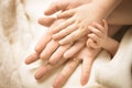 Newborn child hand. Closeup of baby hand into parents hands. Family, maternity and birth concept.