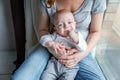 Newborn child laughs in the arms of his mother Royalty Free Stock Photo