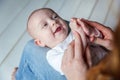 Newborn child lies on his mother`s lap Royalty Free Stock Photo