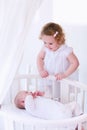 Newborn child meets his sister Royalty Free Stock Photo