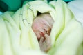 Newborn baby child seconds and minutes after birth wrapped in towel Royalty Free Stock Photo