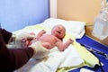 Newborn child seconds and minutes after birth. Check up Royalty Free Stock Photo