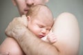 Newborn child sleeping in male arms Royalty Free Stock Photo