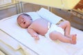 Newborn child under ultraviolet lamps