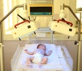 Newborn child under ultraviolet lamps