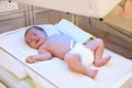 Newborn child under ultraviolet lamps