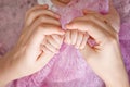 Newborn children`s hand in mother hand. Mom and her Child. Happy Family concept. Beautiful conceptual image of Maternity Royalty Free Stock Photo