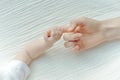 Newborn children`s hand in mother hand. Mom and her Child. Happy Family concept Royalty Free Stock Photo