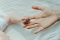 Newborn children`s hand in mother hand. Mom and her Child. Happy Family concept Royalty Free Stock Photo