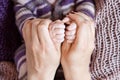 Newborn children`s hand in mother hand. Mom and her Child. Happy Family concept. Beautiful conceptual image of Maternity Royalty Free Stock Photo