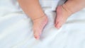 Newborn chubby legs and foots. Beautiful conceptual image of motherhood and baby Royalty Free Stock Photo