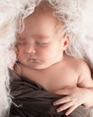 A newborn, cute, sleeping, tiny baby portrait, macro shot. Mom and her baby. The concept of a happy family Royalty Free Stock Photo