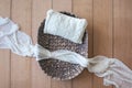 Newborn digital background - brown bowl with white knitted pillow and white sheer layer of fabric on wooden background