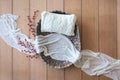 Newborn digital background - woven basket with white knitted pillow, white cheese cloth and red berries branch on wooden