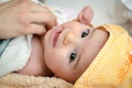 Newborn eyes closeup gaze baby face portrait hood Royalty Free Stock Photo