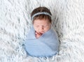 Newborn girl in blue wrap Royalty Free Stock Photo