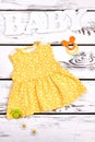 Newborn girl cute yellow dress. Royalty Free Stock Photo