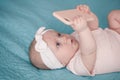 Newborn girl with phone Royalty Free Stock Photo