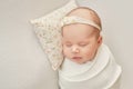 Newborn girl on a light background Royalty Free Stock Photo