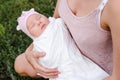 Newborn girl sleeps sweetly in mom`s arms Royalty Free Stock Photo