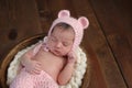 Newborn Girl Wearing a Pink Bear Hat Royalty Free Stock Photo